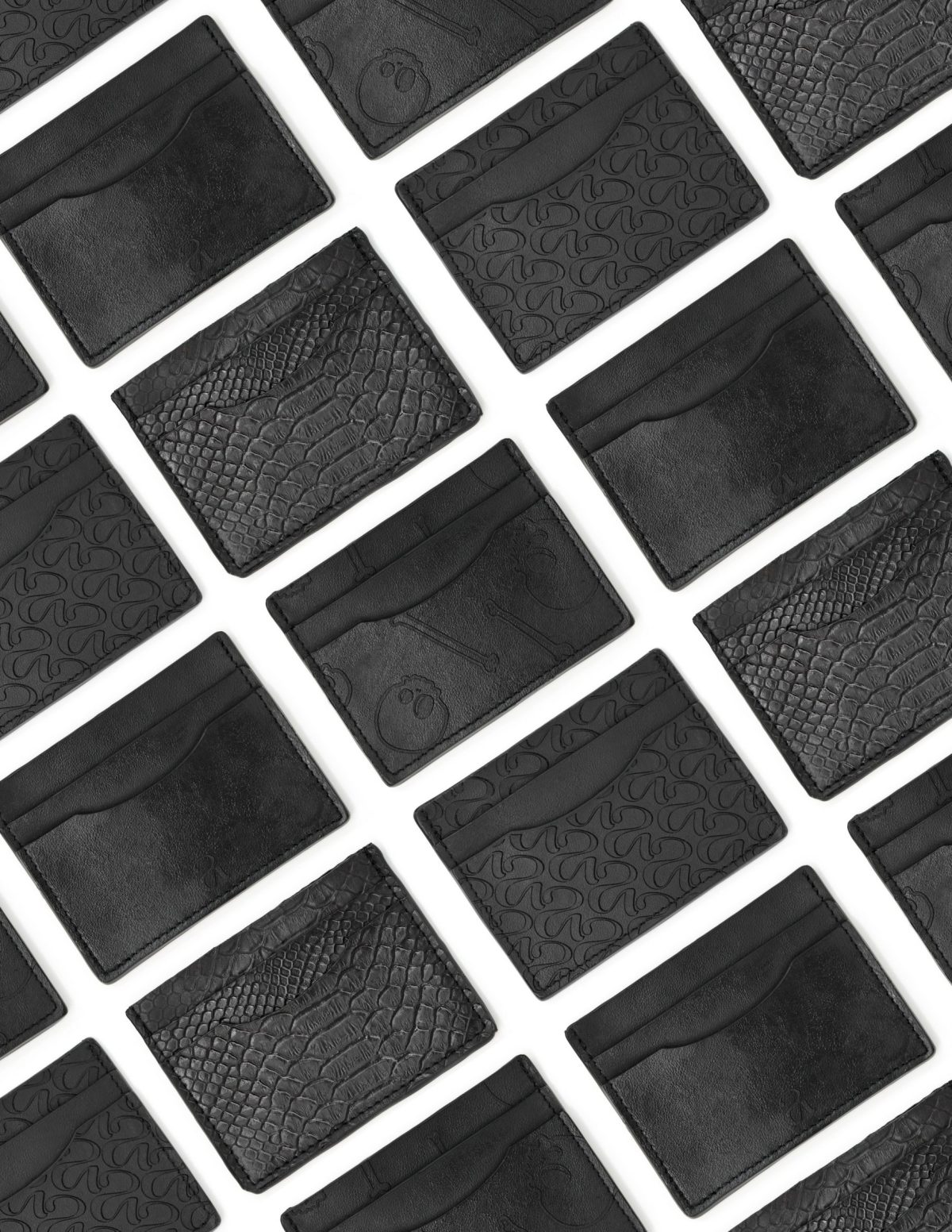 Array of black leather cardholders made from sustainable beer grain