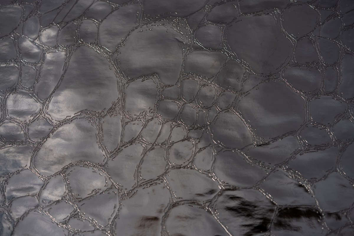 Close-up metallic textured surface of beer grain leather material