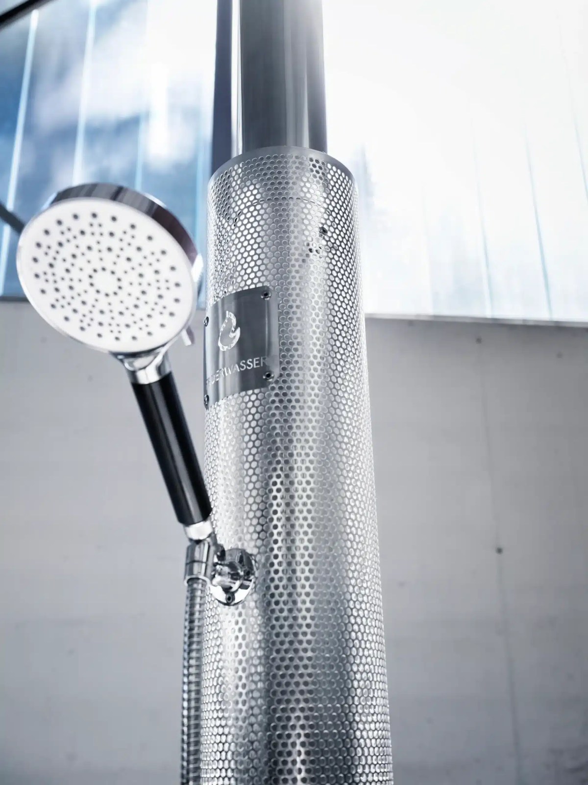 Close-up of the Feuerwasser stainless steel showerhead and column