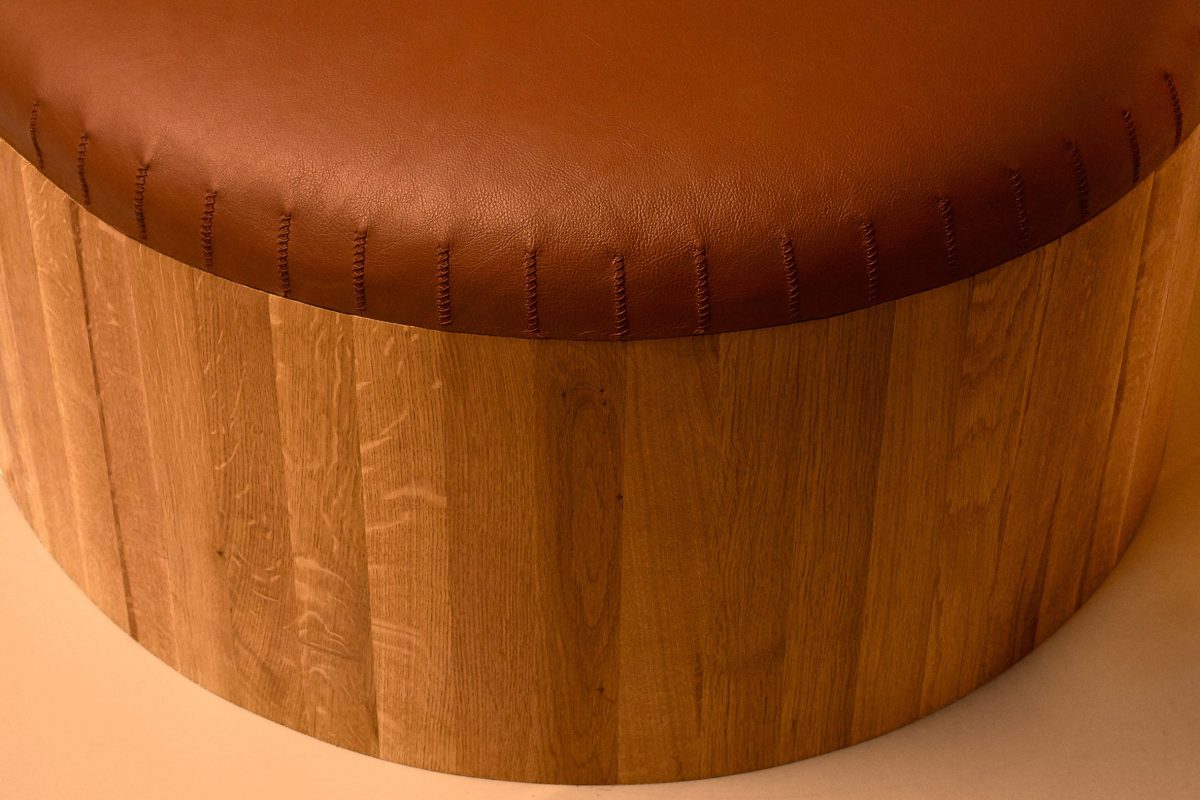 Round ottoman brown leather top with sculptural column base Joe Doucet Oublier