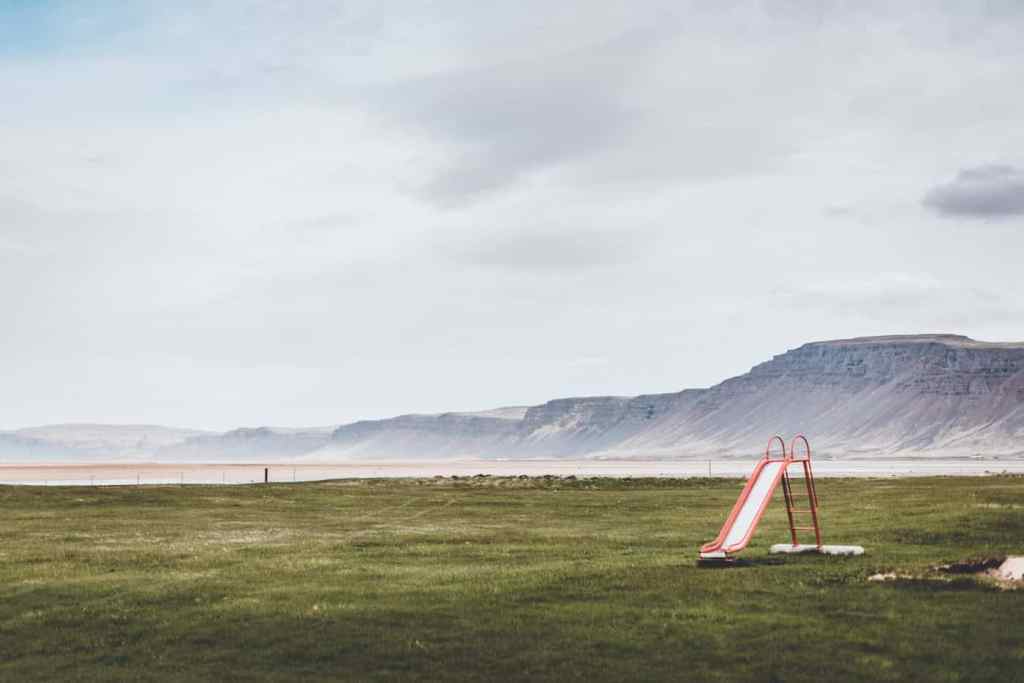 Westfjords Iceland - natural hot spring pool with fjord backdrop